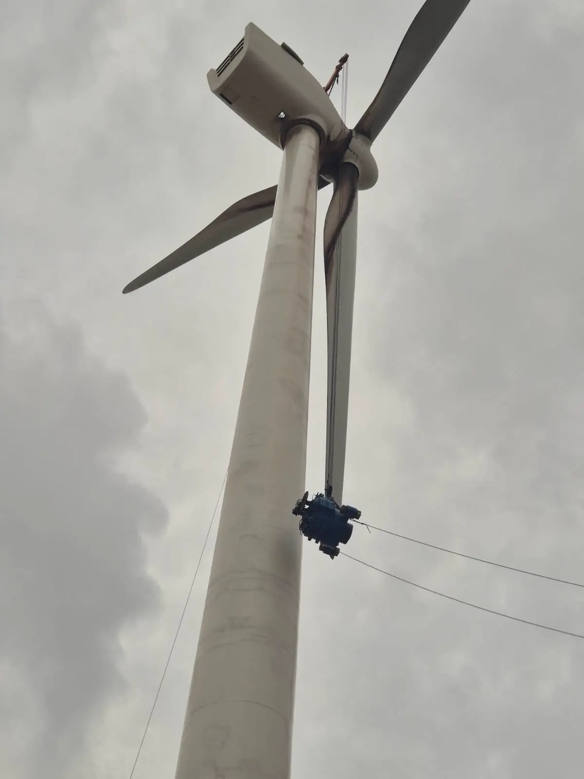 Wind turbine against blue sky